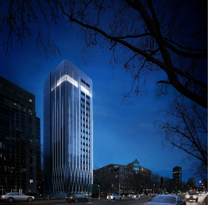 Modern car stacker building illuminated at night